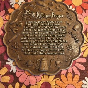 Vintage 1970s raised relief ‘My Kitchen Prayer’ faux-bronze wall plaque with embossed kitchen motifs.
