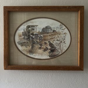 Vintage 1978 framed countryside print featuring quail, antique truck, and farmhouse in wooden frame with oval matte.