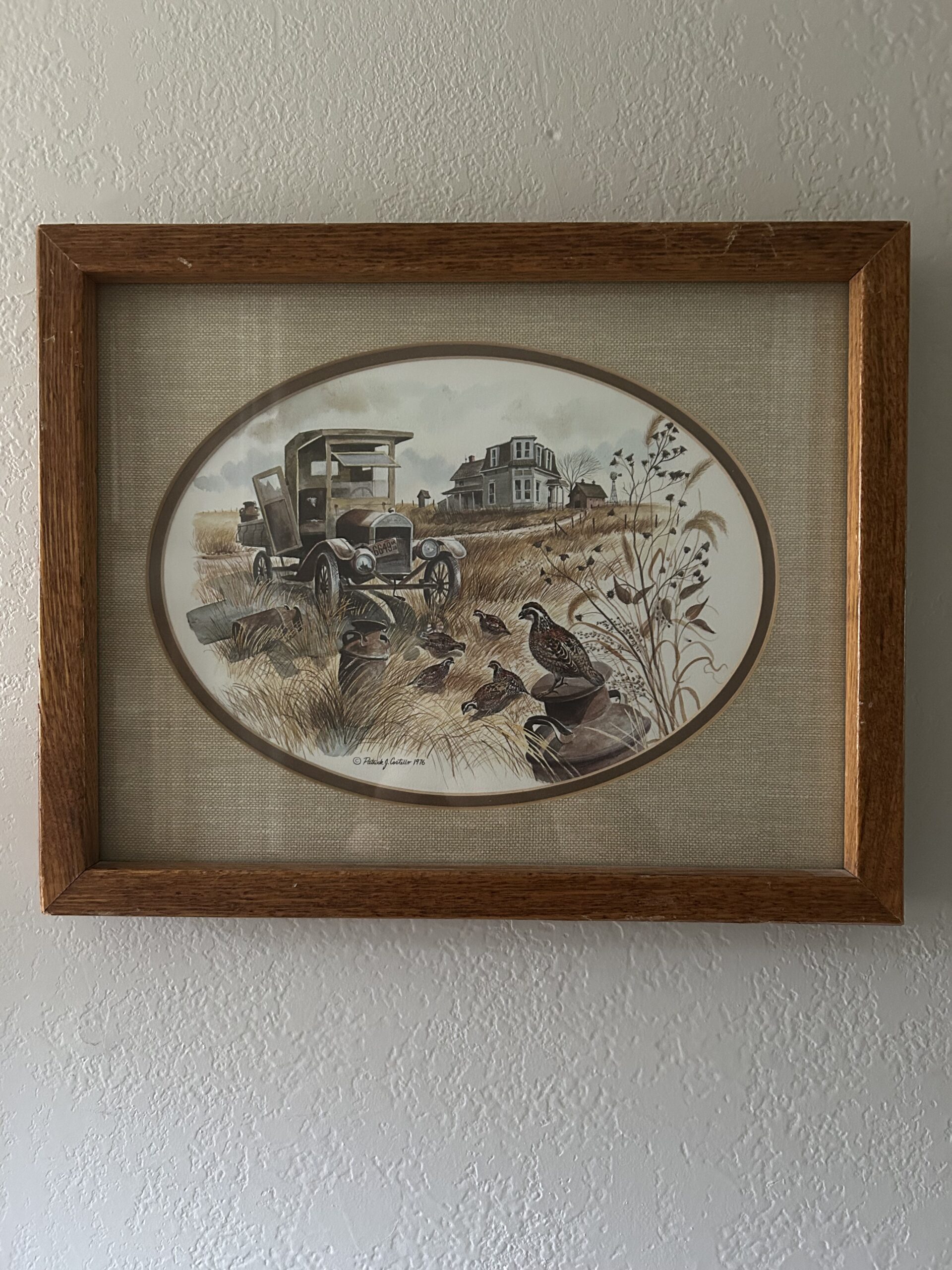Vintage 1978 framed countryside print featuring quail, antique truck, and farmhouse in wooden frame with oval matte.