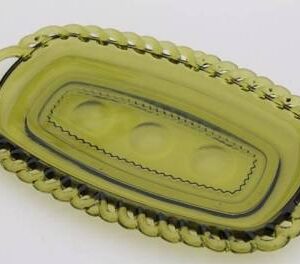 Vintage Indiana Glass "Kings Crown" pattern small handled oval tray in avocado green glass with a thumbprint border.