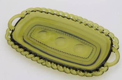 Vintage Indiana Glass "Kings Crown" pattern small handled oval tray in avocado green glass with a thumbprint border.
